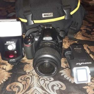 Nikon D3100 with detachable flash,32gb card,carry